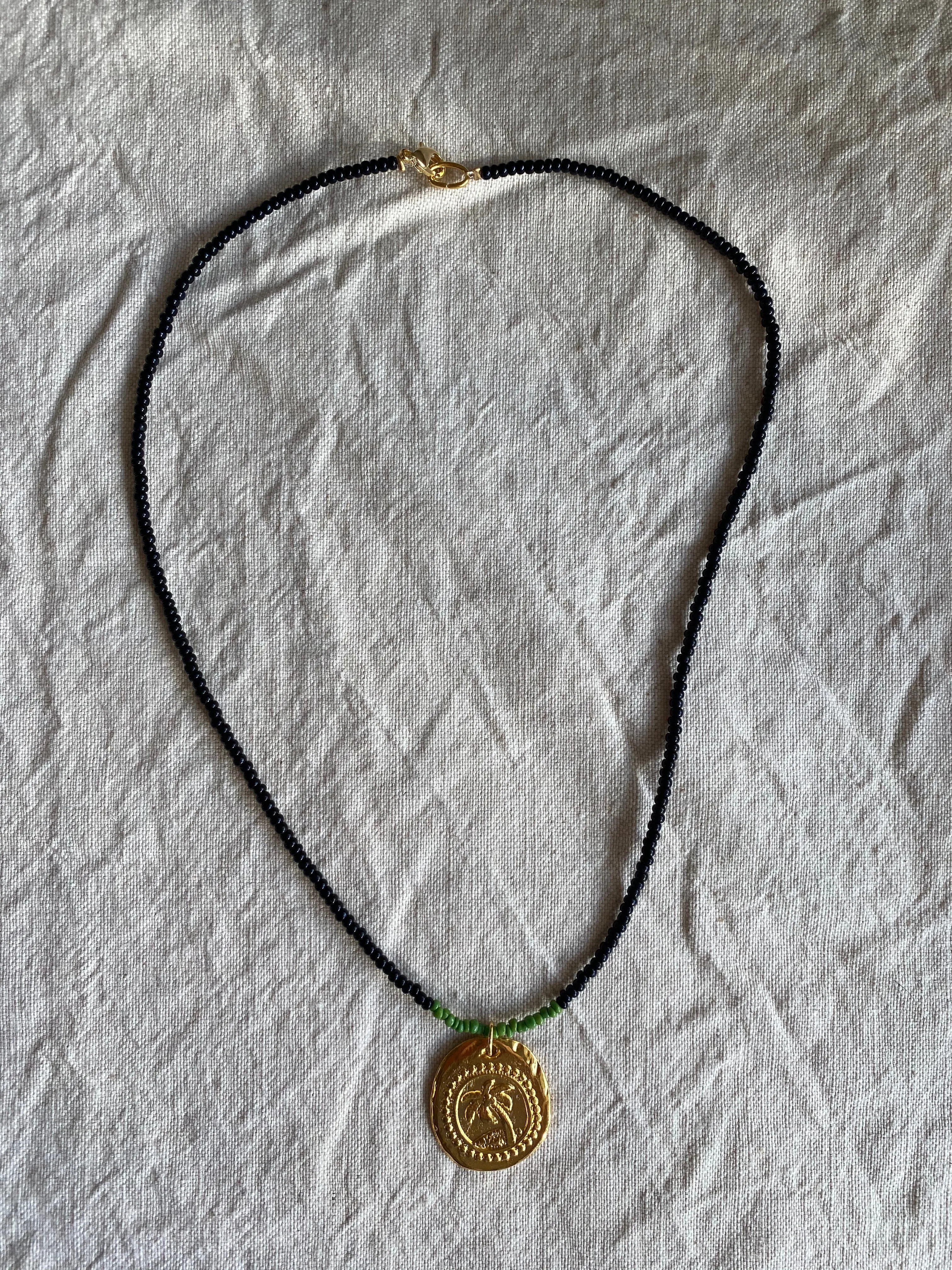 Collar Palmier by night